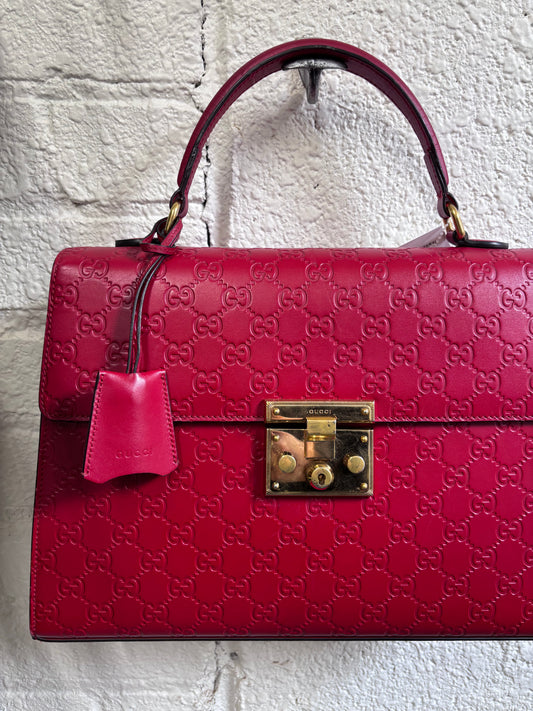 Gucci Guccissima Signature Medium Padlock Top Handle Leather Bag in Hibiscus Red